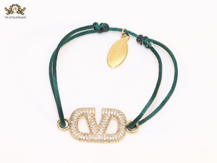 Alphabet V gold cz on green thread