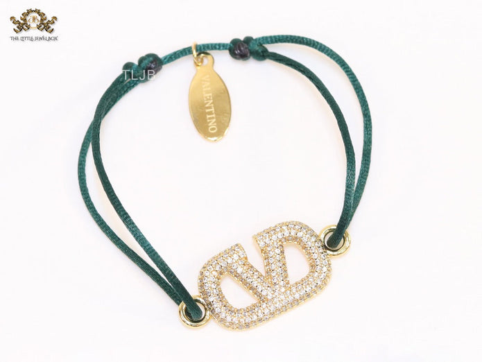 Alphabet V gold cz on green thread