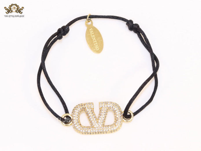 Alphabet V gold cz on black thread Bracelet