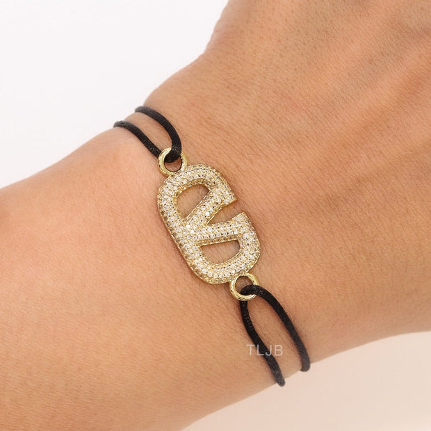 Alphabet V gold cz on black thread Bracelet
