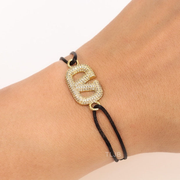 Alphabet V gold cz on black thread Bracelet