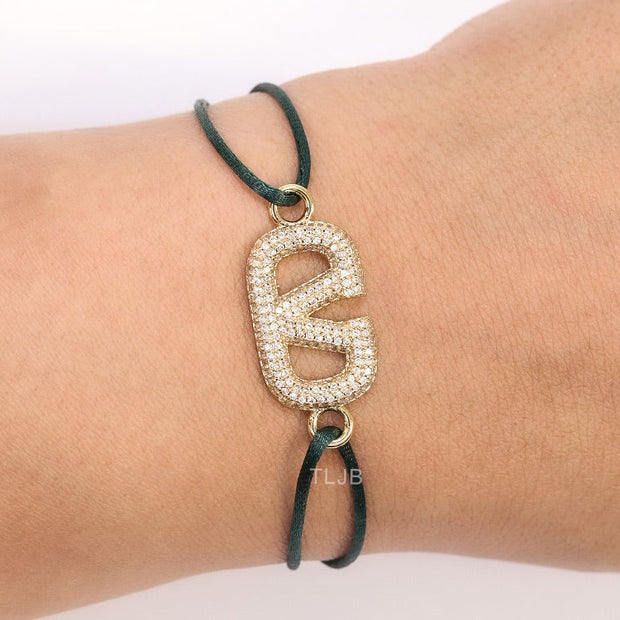 Alphabet V gold cz on green thread
