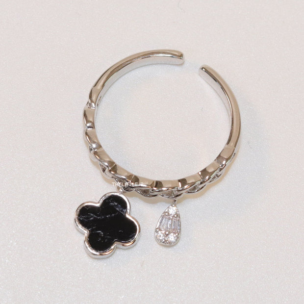 Platinum plated link chain ring with black clover and cz drop