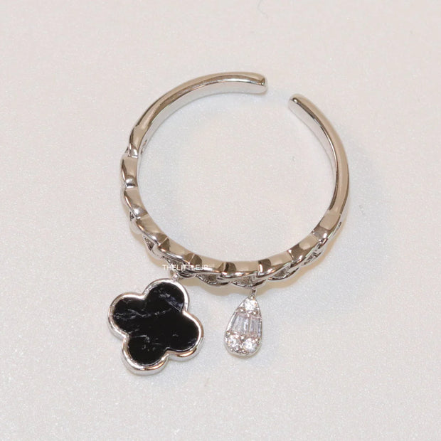 Platinum plated link chain ring with black clover and cz drop