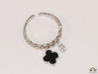 Platinum plated link chain ring with black clover and cz drop