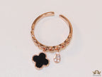 Rose gold plated link chain ring with black clover and cz drop