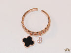 Rose gold plated link chain ring with black clover and cz drop