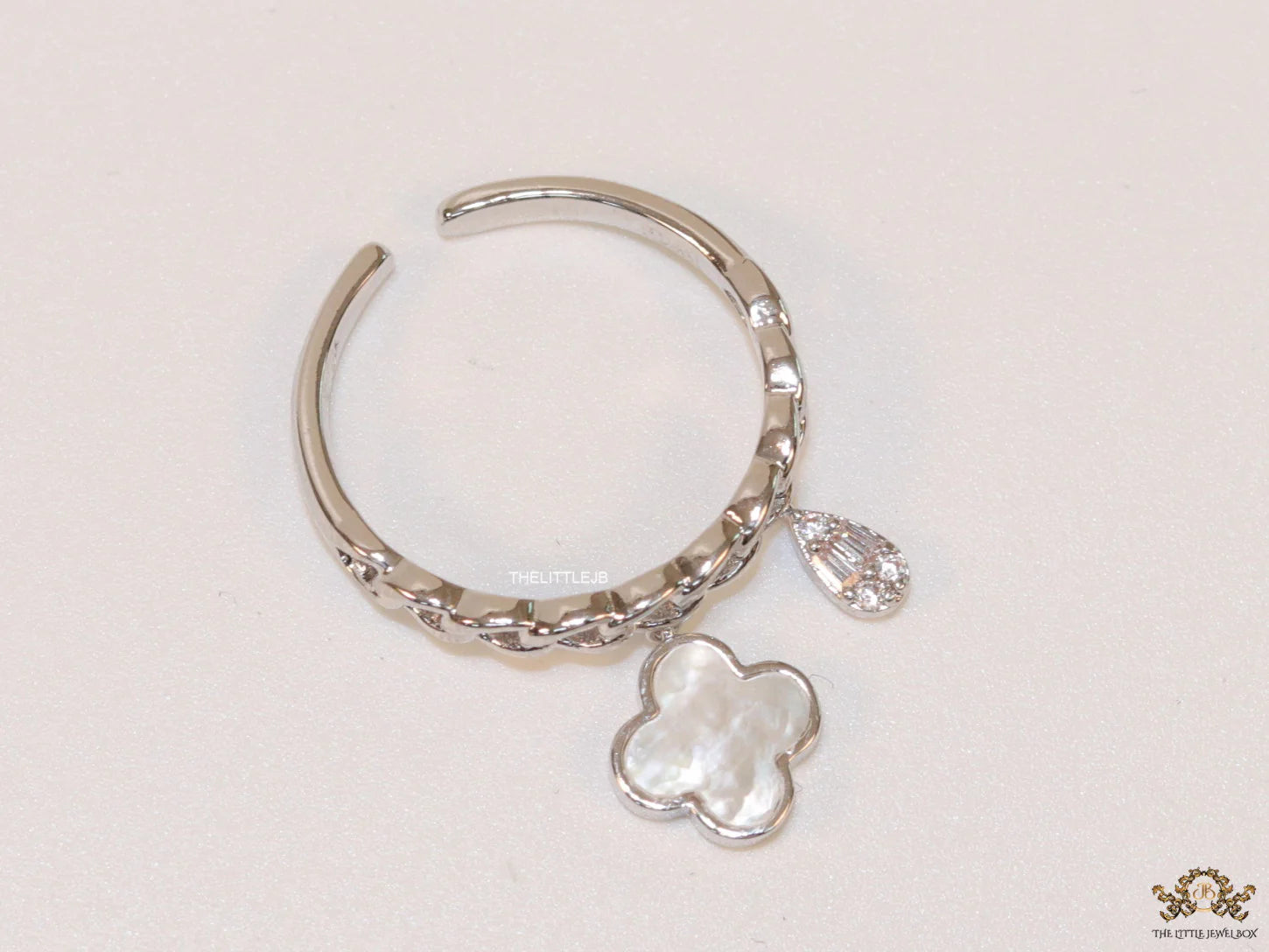 Platinum plated link chain ring with MOP clover and cz drop