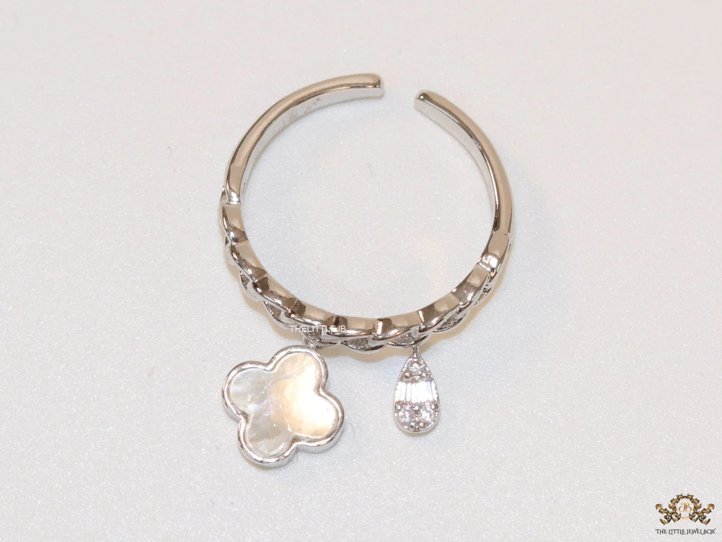 Platinum plated link chain ring with MOP clover and cz drop