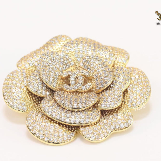Double C gold & cz flower brooch