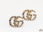 Antique gold plated twin G motif studs with multicoloured enamel