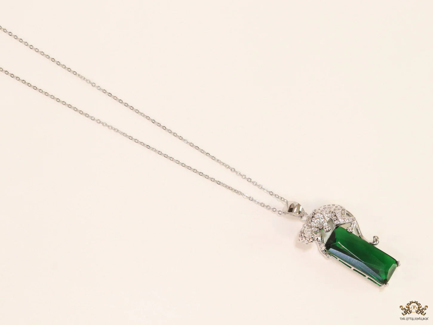 Platinum plated leopard on green stone pendant necklace with cz