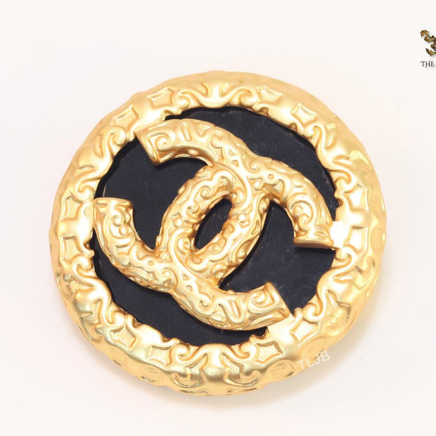 Double C gold foil and black enamel brooch