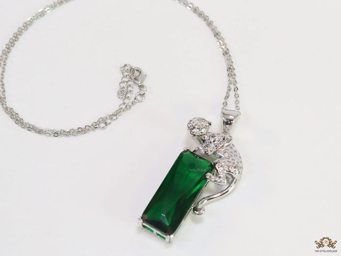 Platinum plated leopard on green stone pendant necklace with cz
