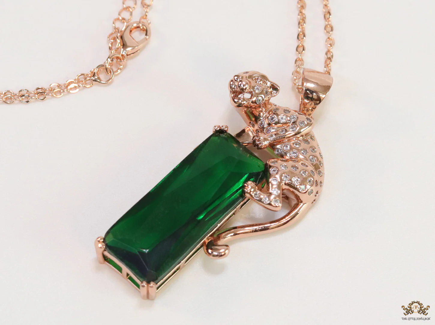 Rose gold plated leopard on green stone pendant necklace with cz