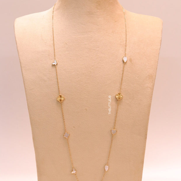 Pearl white clover heart and other shape charms on a sleek long gold plated chain with matching studs