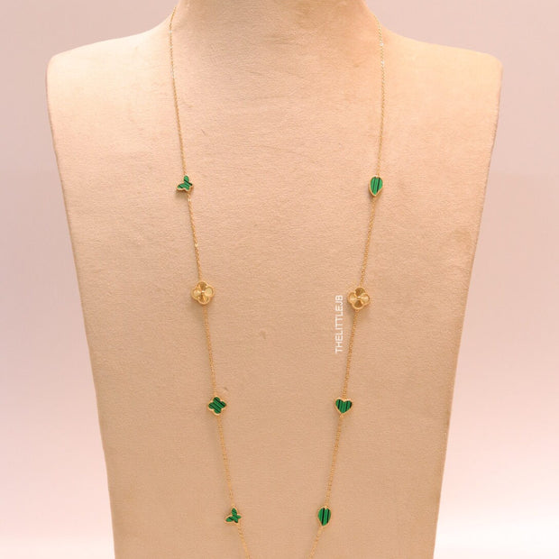 Emerald green clover heart and other shape charms on a sleek long gold plated chain with matching studs
