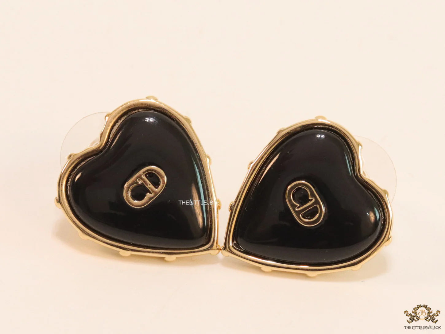 Heart shape black stud earrings with golden alphabets