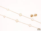 Pearl white clover heart and other shape charms on a sleek long gold plated chain with matching studs