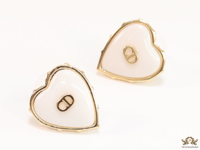 Heart shape white stud earrings with golden alphabets