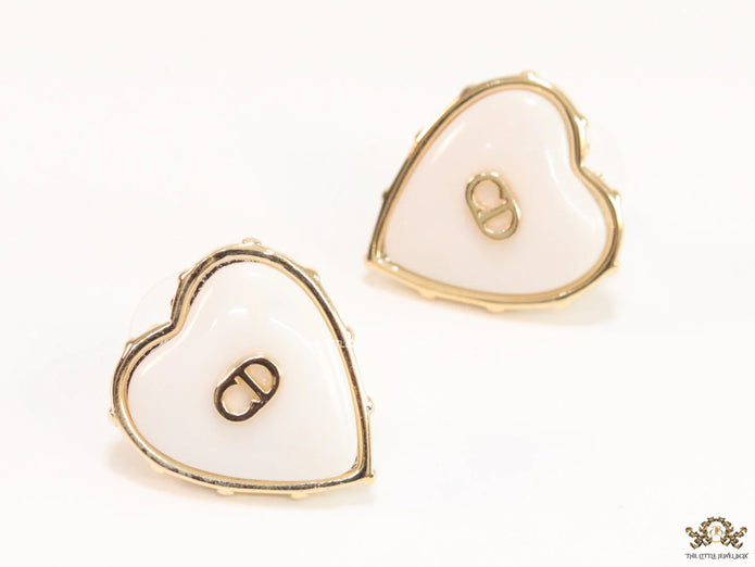 Heart shape white stud earrings with golden alphabets