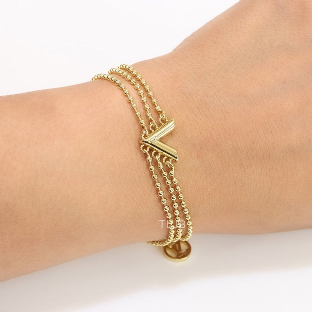 Alphabet V triple layered gold bracelet