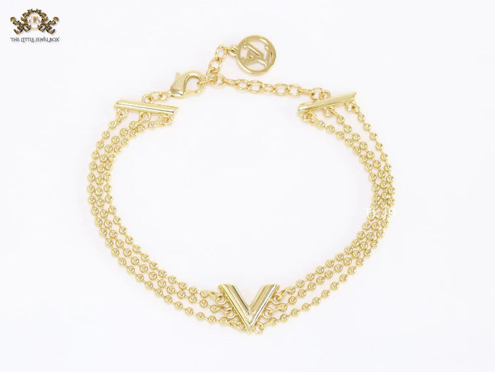 Alphabet V triple layered gold bracelet