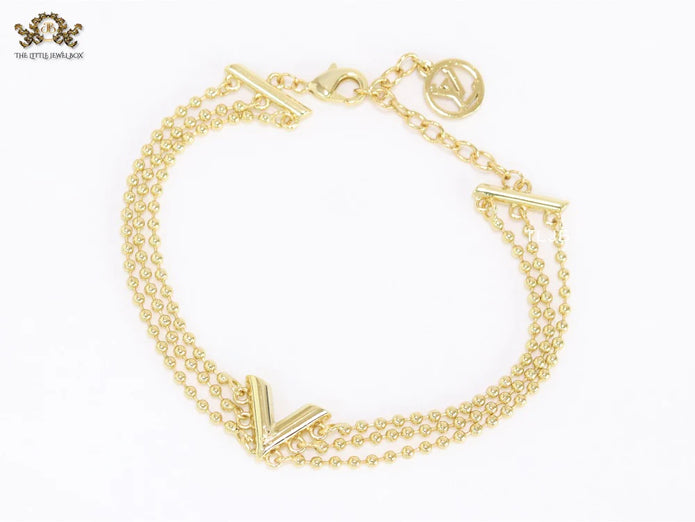 Alphabet V triple layered gold bracelet