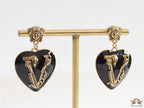 Gold plated medusa earrings with V motif black heart shape drop