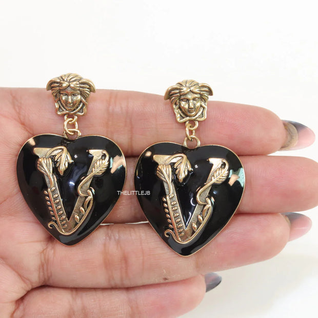 Gold plated medusa earrings with V motif black heart shape drop