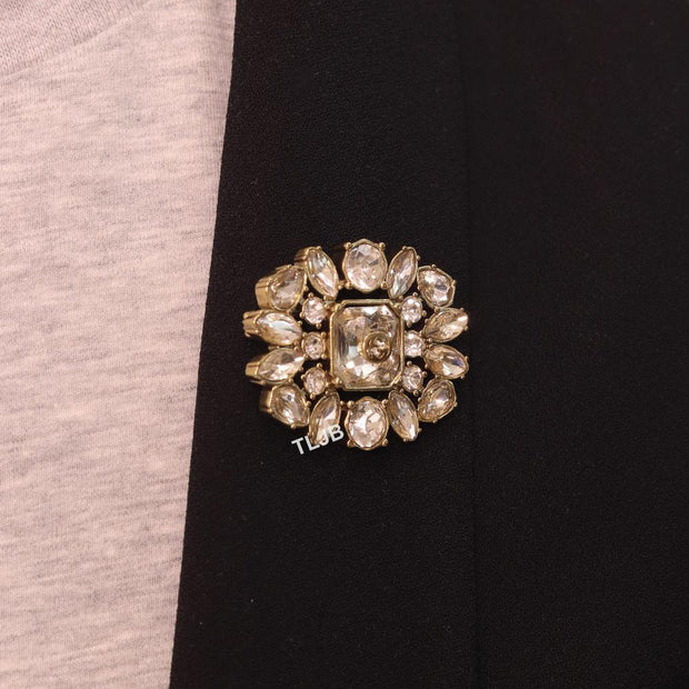 Double G brooch with uncut stones