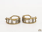 Broad golden hoops with cz alphabets