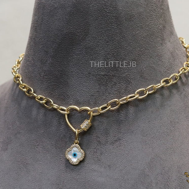 Gold plated link chain necklace with heart shaped lock and evil eye clover pendant