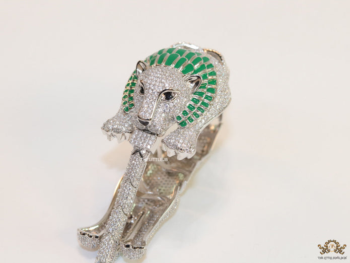 Platinum plated unique panther bracelet with cz and emerald green stones