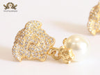 Medusa & off-white pearl earrings with cz