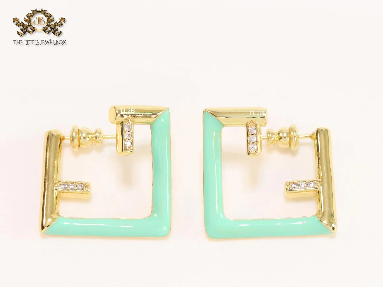 Double F & cyan enamel studs