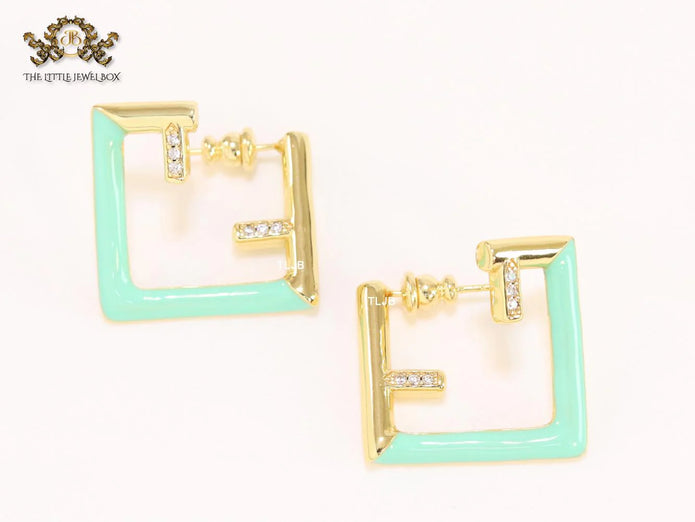 Double F & cyan enamel studs