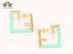 Double F & cyan enamel studs