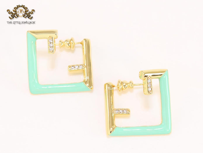 Double F & cyan enamel studs