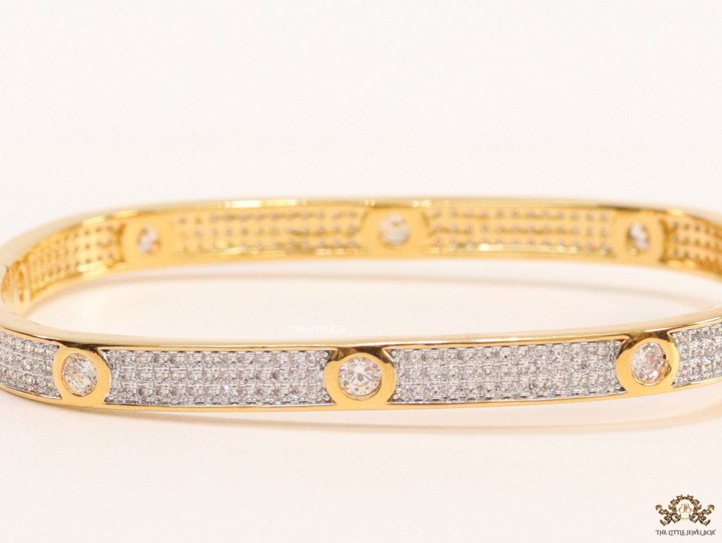 Gold plated openable bracelet studded with cz