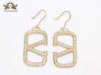 Alphabet open V cz and gold danglers