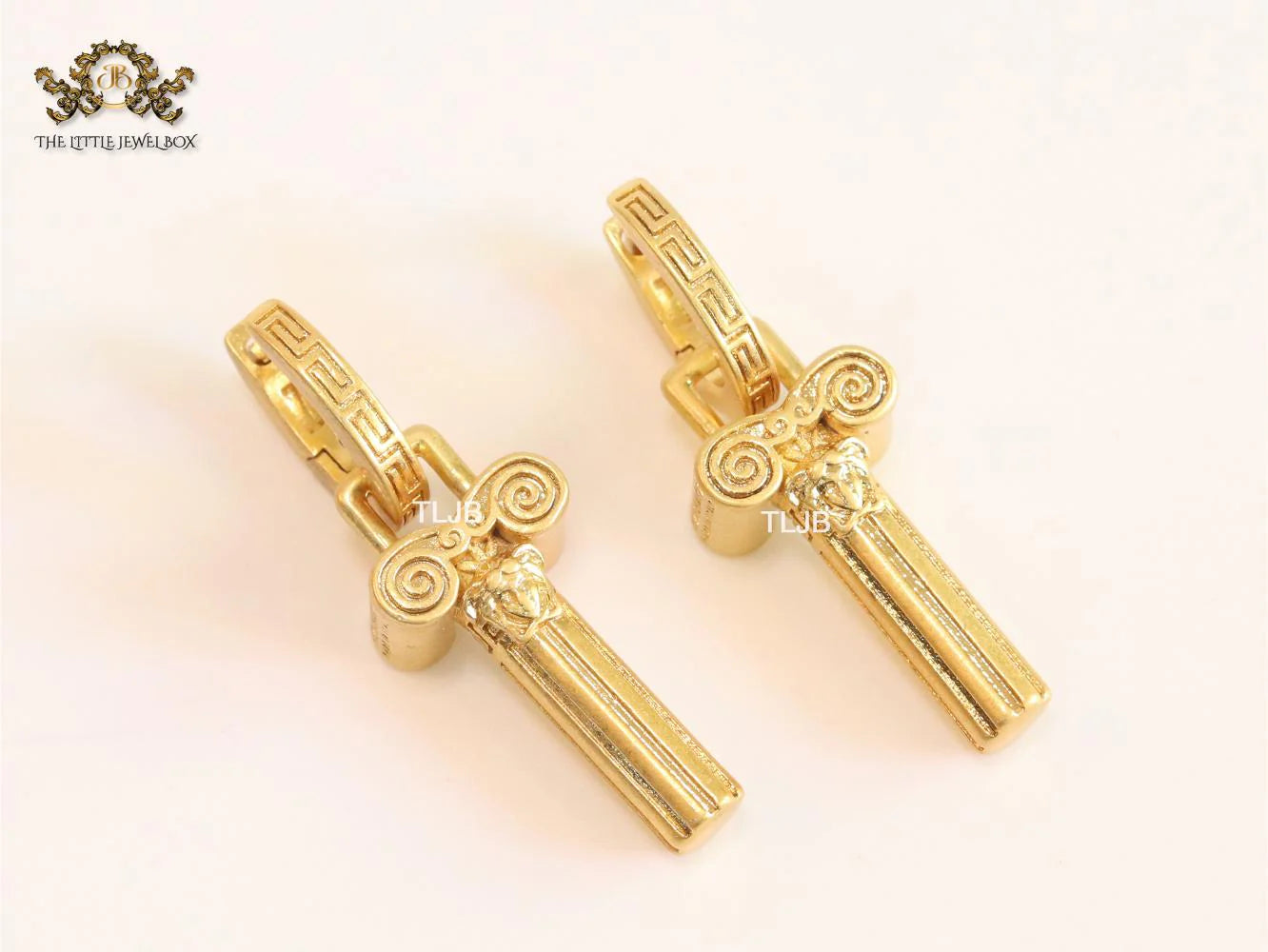Medusa embossed gold key hoops