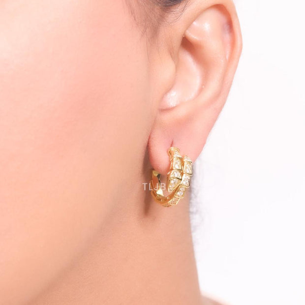 Gold serpentine hoops