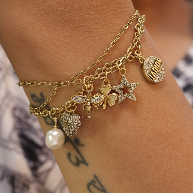 Multilayered gold plated chain bracelet with various cz charms