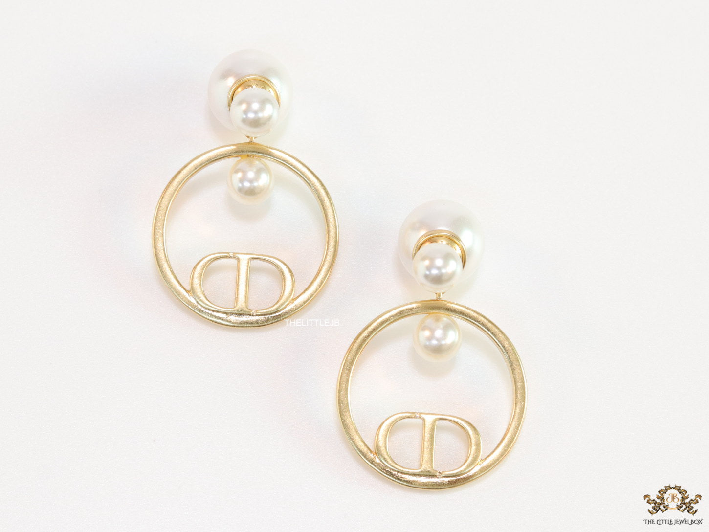Pearl bomber earrings with golden alphabet ring drop