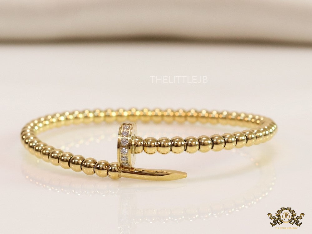 Gold plated openable nail bracelet with cz and metallic beads