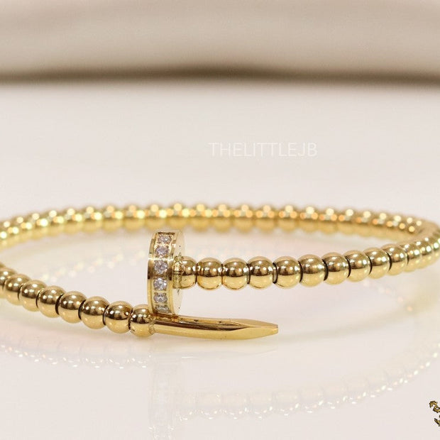 Gold plated openable nail bracelet with cz and metallic beads