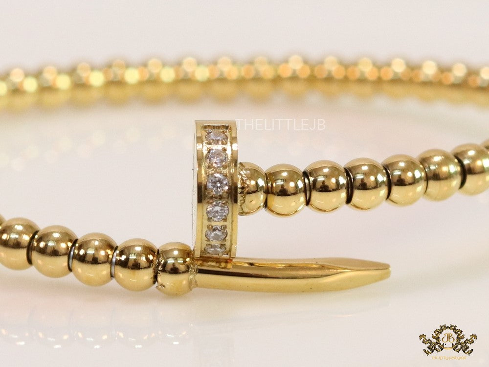 Gold plated openable nail bracelet with cz and metallic beads
