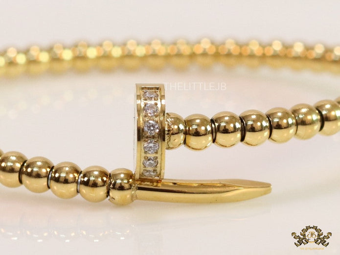 Gold plated openable nail bracelet with cz and metallic beads