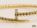 Gold plated openable nail bracelet with cz and metallic beads